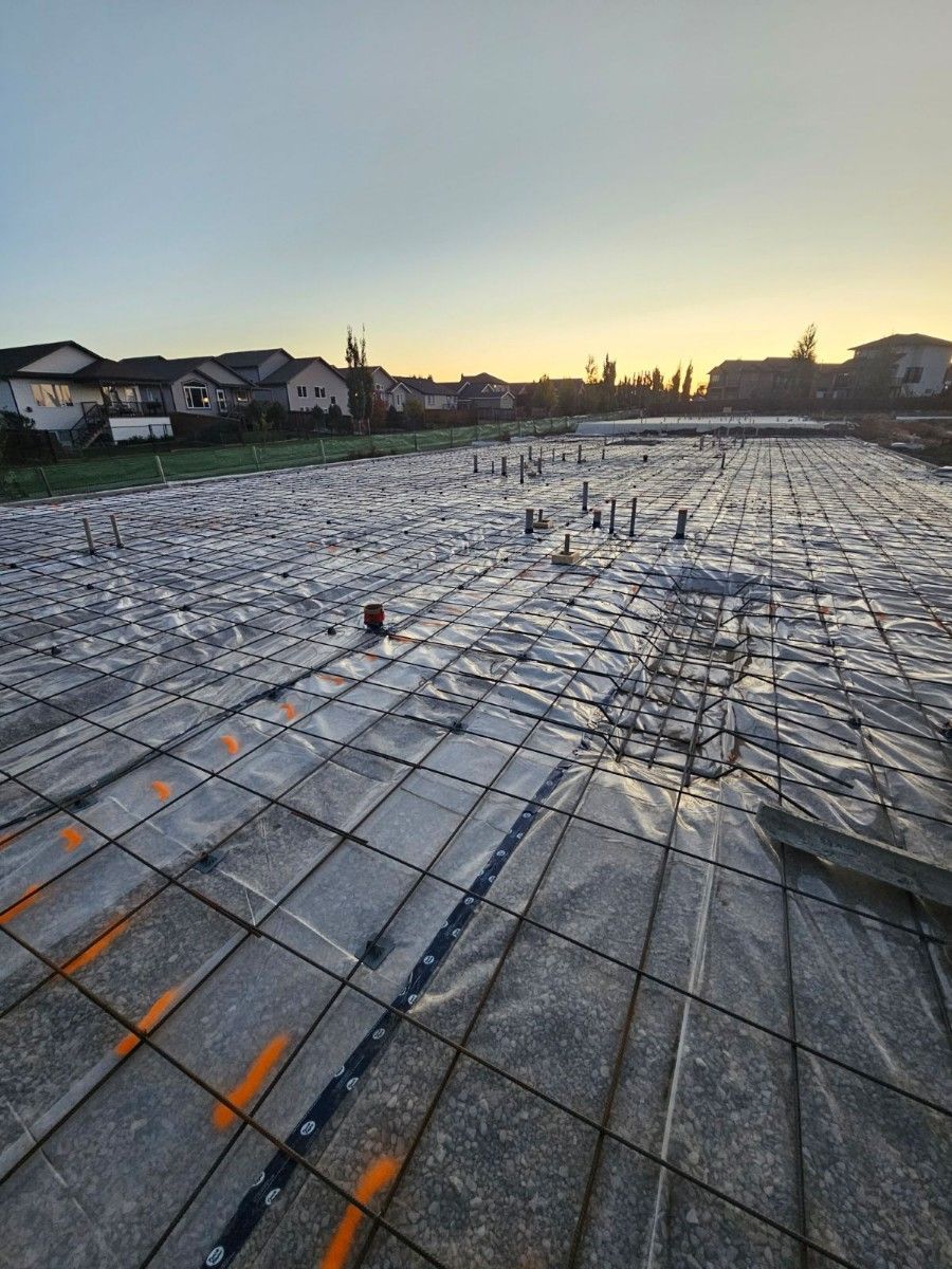 A large concrete floor with a lot of plastic covering it.