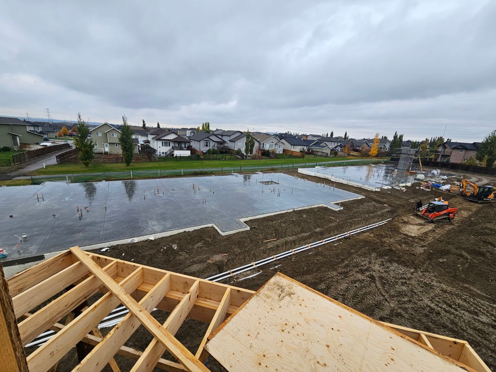 A construction site with a large body of water in the background.