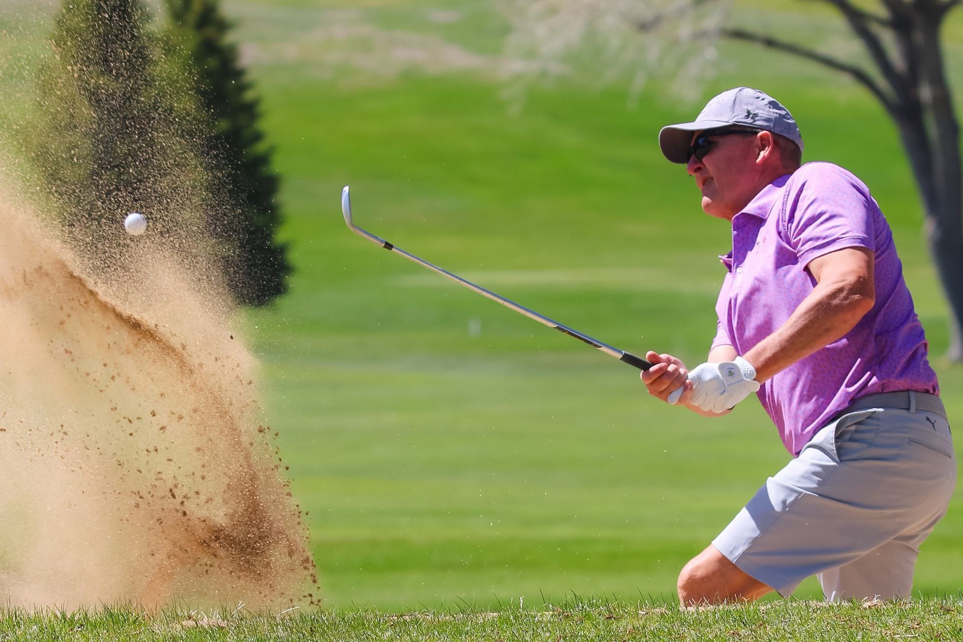 Golfer hitting bunker shot at Casper Country Club