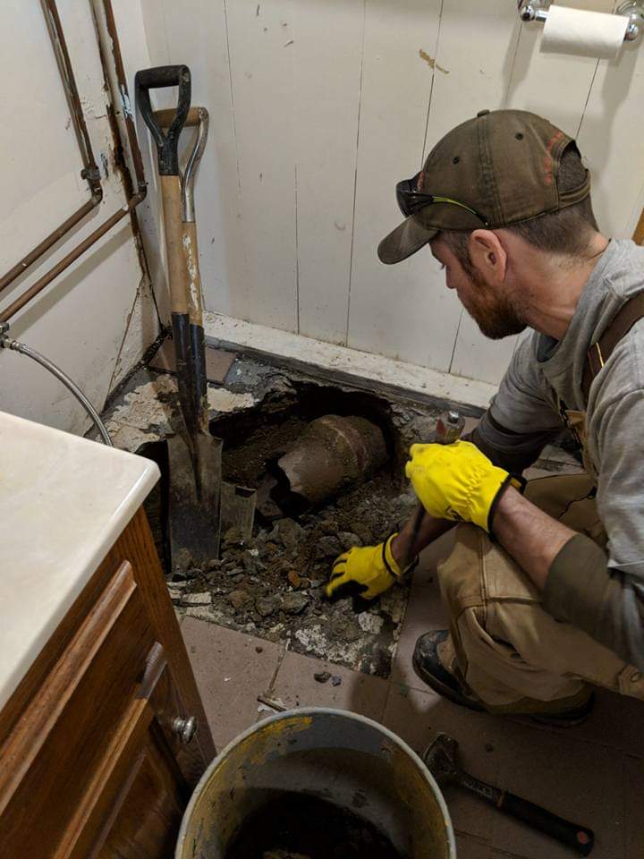 Worker Fixing Pipes — Lakewood, OH — Madison Plumbing & Heating