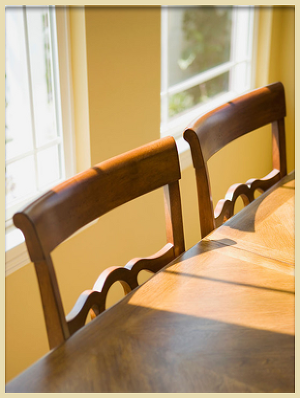 close up of polished wooden dining chairs and table