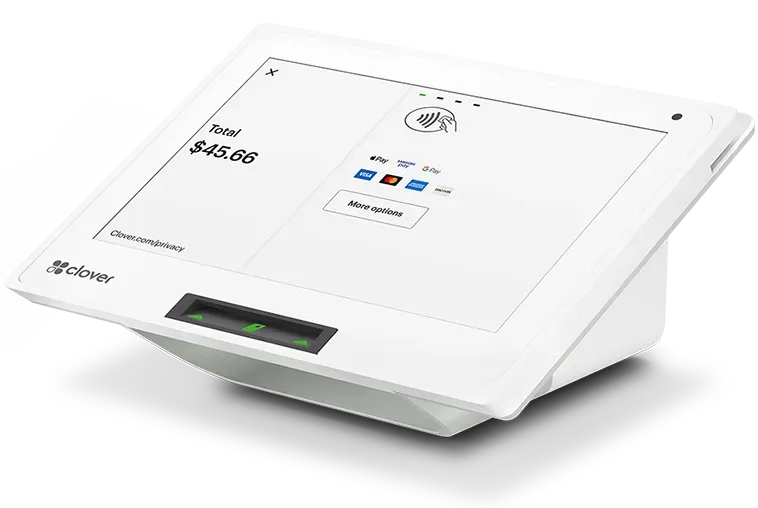 A white tablet is sitting on a white surface.