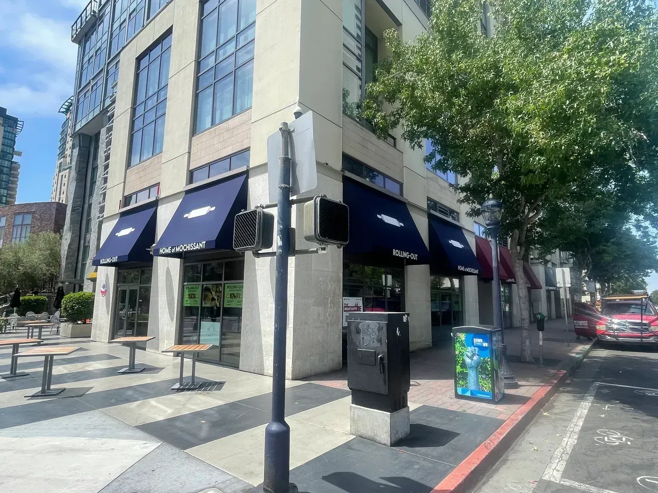 A living room with a stone fireplace and a flat screen tv
