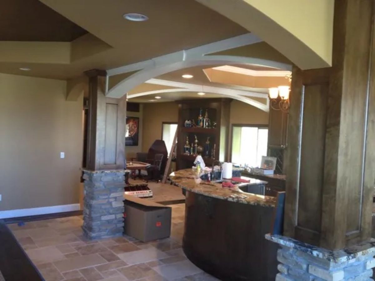 a kitchen with a large island in the middle of it