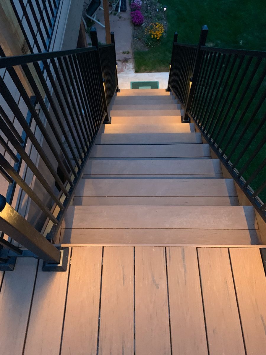 a wooden deck with stairs leading up to it