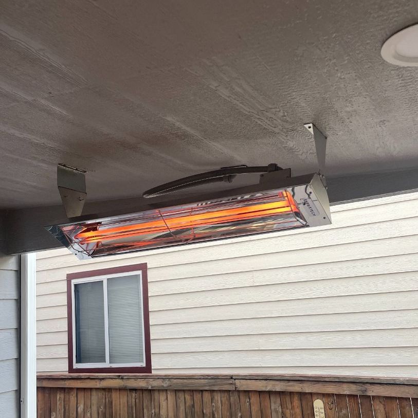 a heater is installed from the ceiling of a house or patio