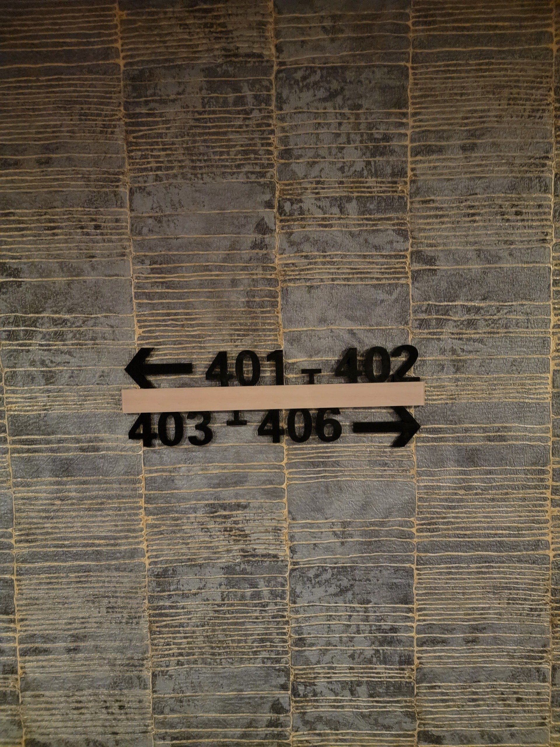 A sign on a wall that says 401 402 403 406