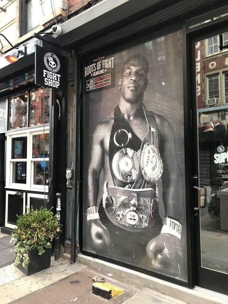 A black and white photo of a boxer on a window.