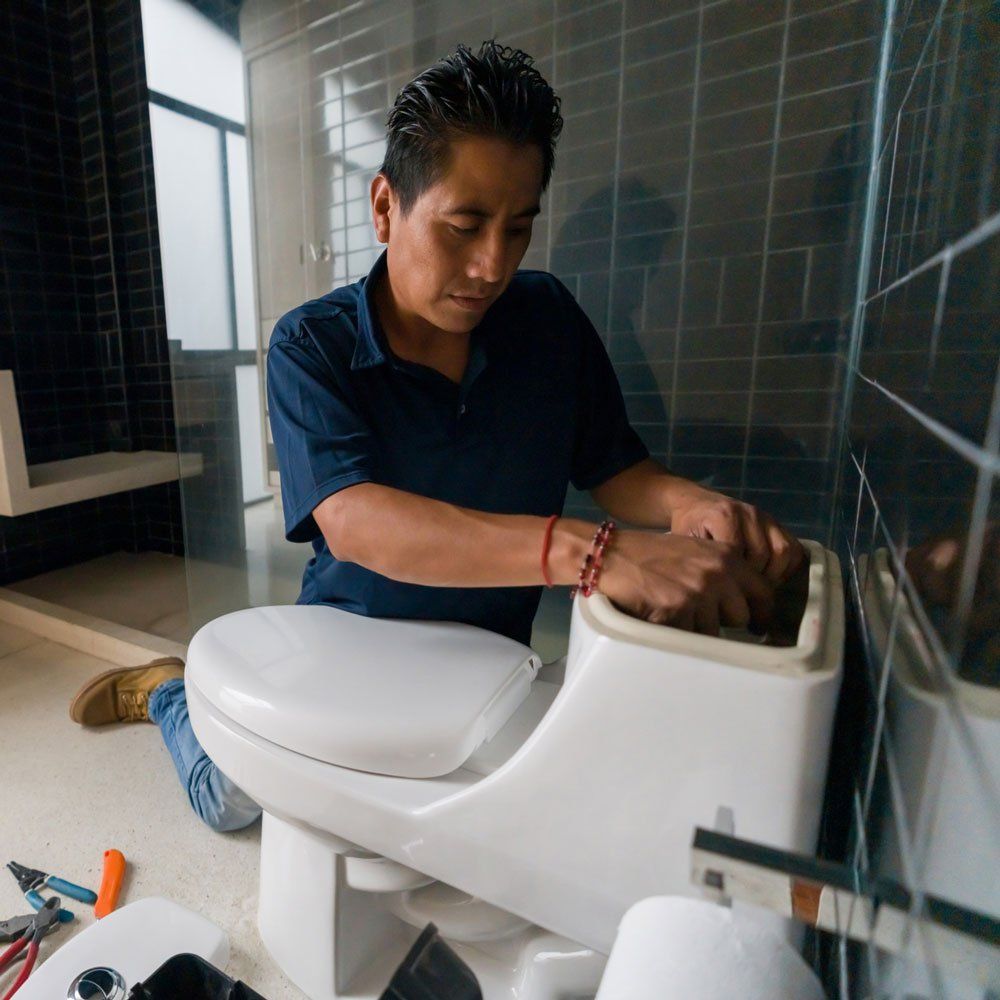 Plumber Repairing Toilet — Bartlesville, OK — Mason's Plumbing