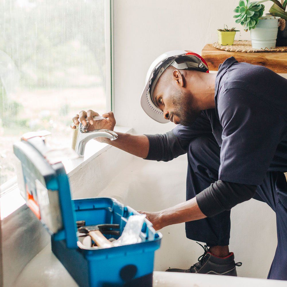 Plumber Checking Faucet — Bartlesville, OK — Mason's Plumbing