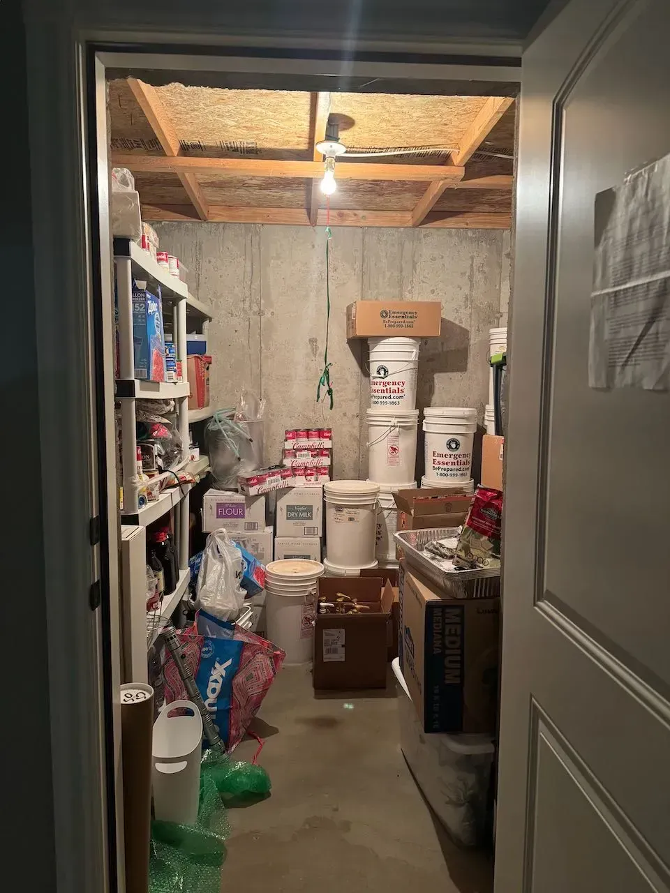 A room filled with lots of buckets and boxes.
