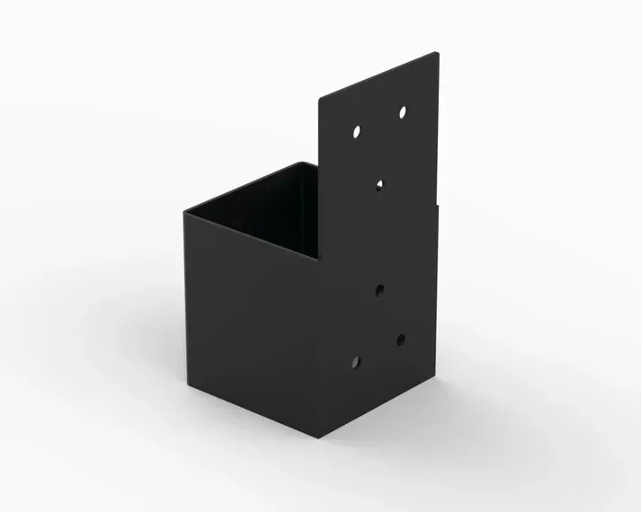 A black box with holes in it is sitting on a white surface.