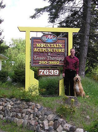 Marcel Mallette & Possum at Clinic sign on Silver Star Rd