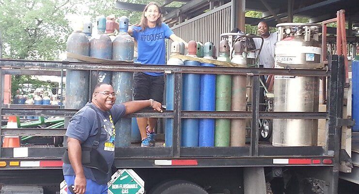 Man And Woman With Tanks — Pompano Beach, FL — County Welding Equipment