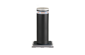 A black cylindrical object is sitting on a white surface.
