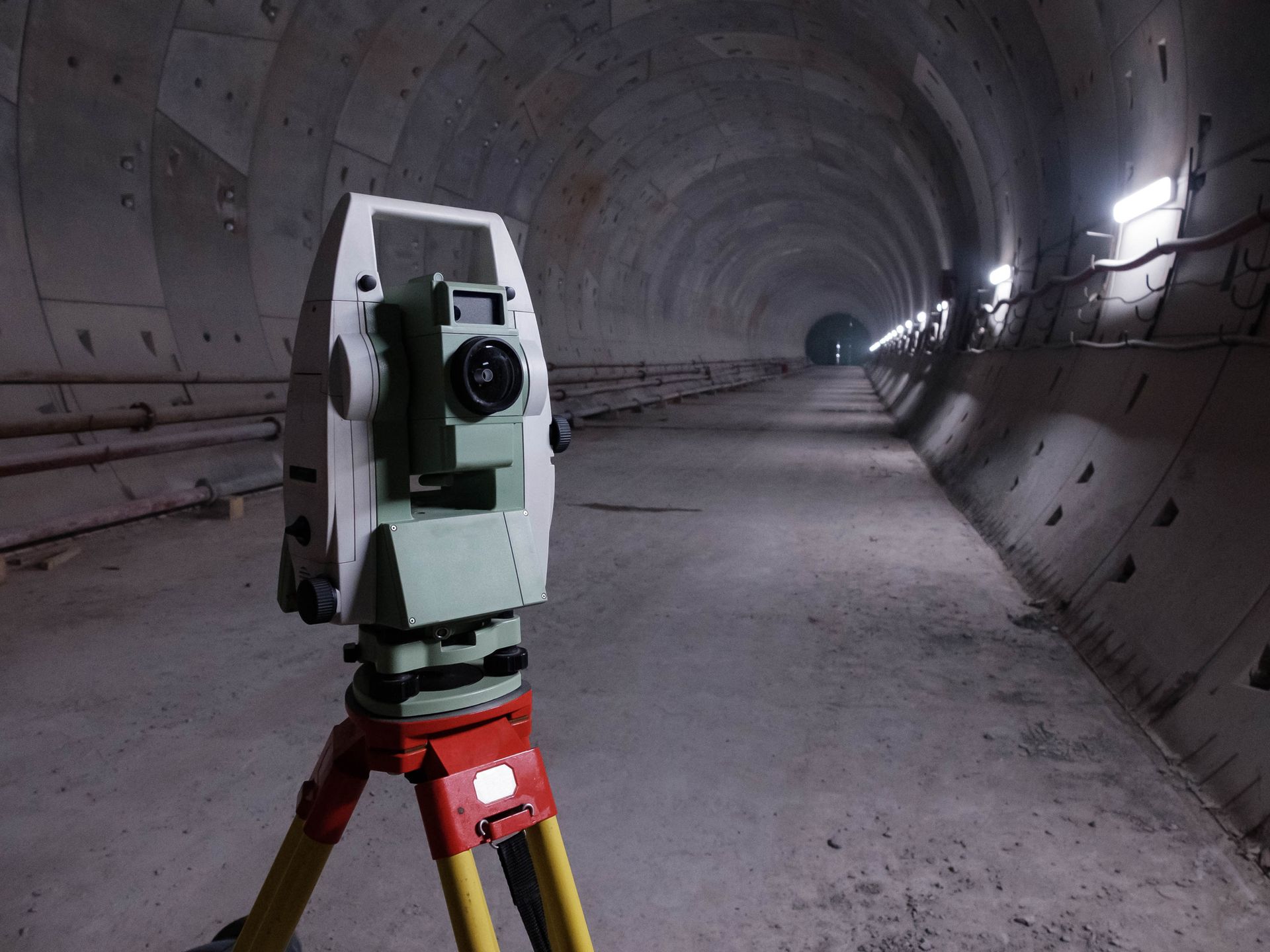 Geodetic total station in the tunnel of metro under construction.