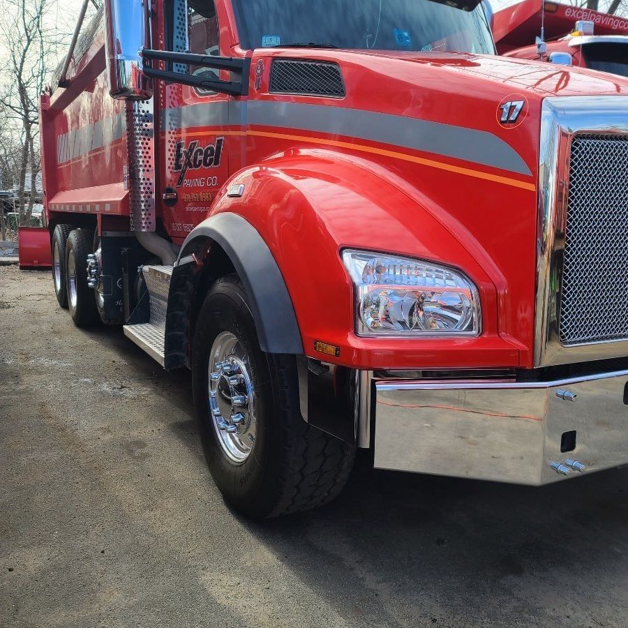 A red truck with the word excel on the front