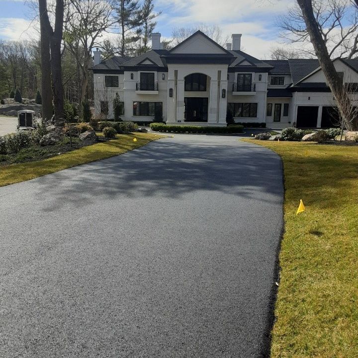 A large house with a driveway leading to it