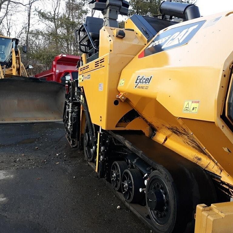 A yellow excavator with the word excel on it