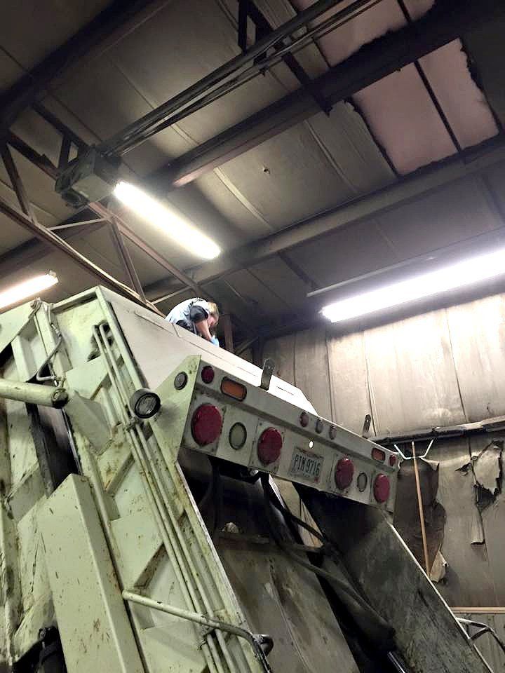 Man Working Above The Truck — Zanesville, OH — Goody’s Garage