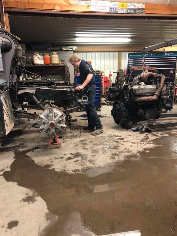 Man Repairing Truck — Zanesville, OH — Goody’s Garage