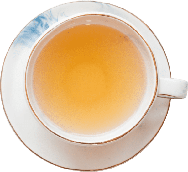 A cup of tea is on a saucer on a white background
