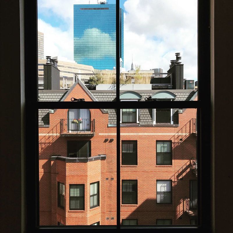 A view of a brick building through a window
