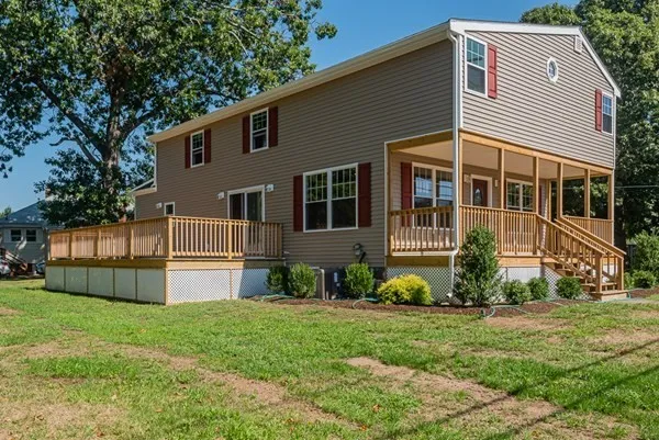 A large house with a large porch and stairs