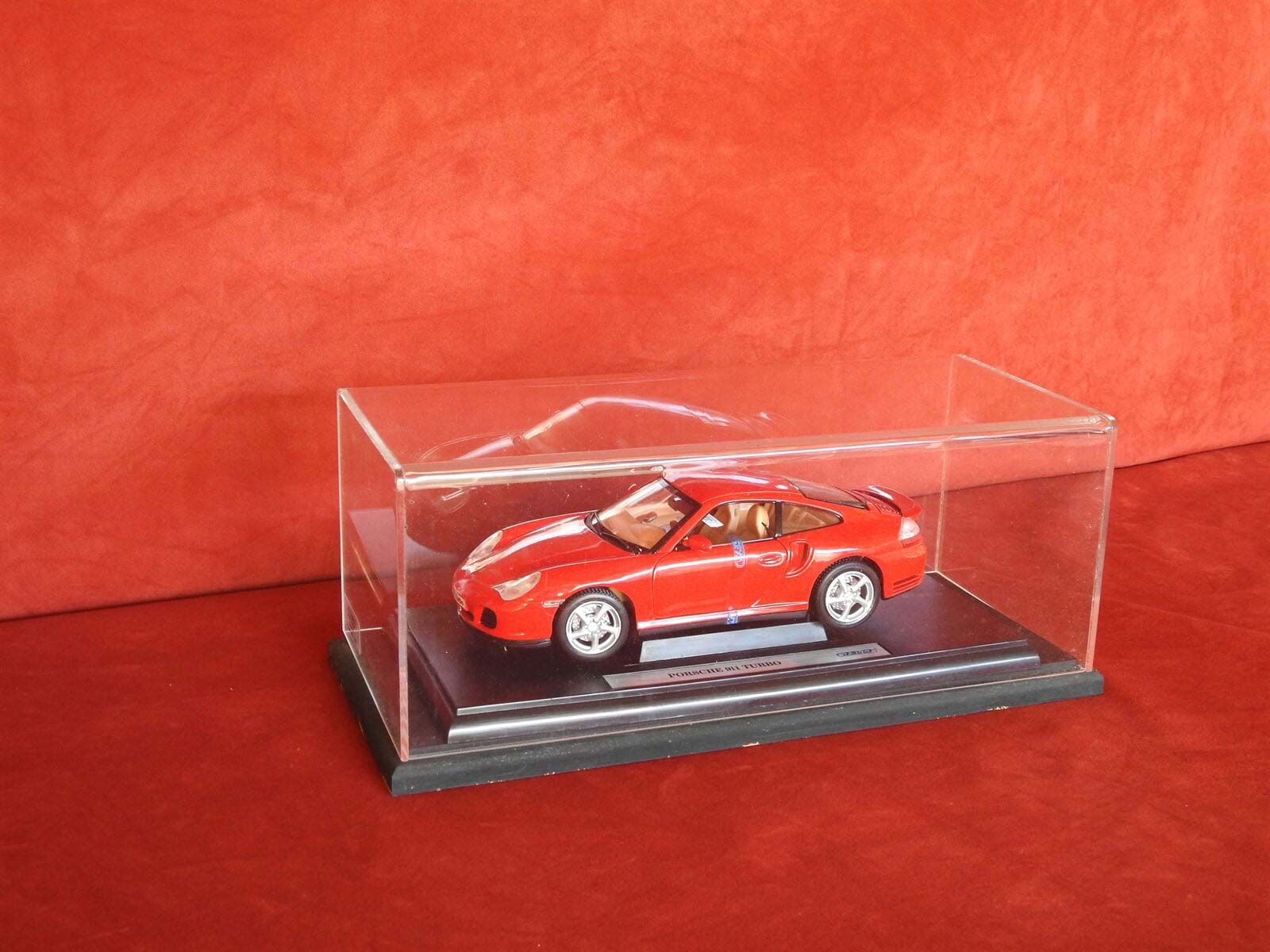 A red Toy car is in a Clear Display case — Light Industries in Bowral, NSW