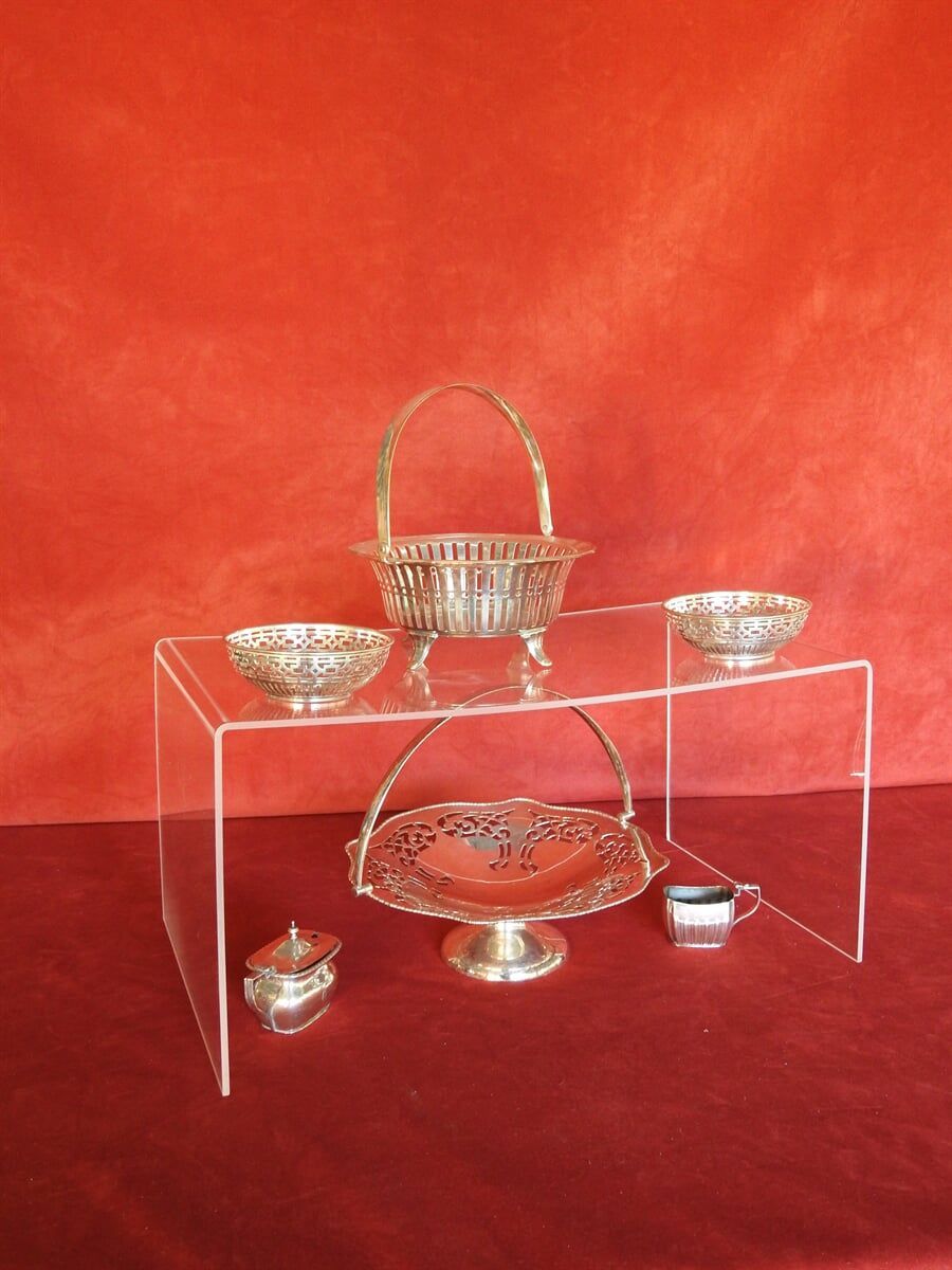 A Clear Display With Silver Bowls And A Basket — Light Industries in Bowral, NSW