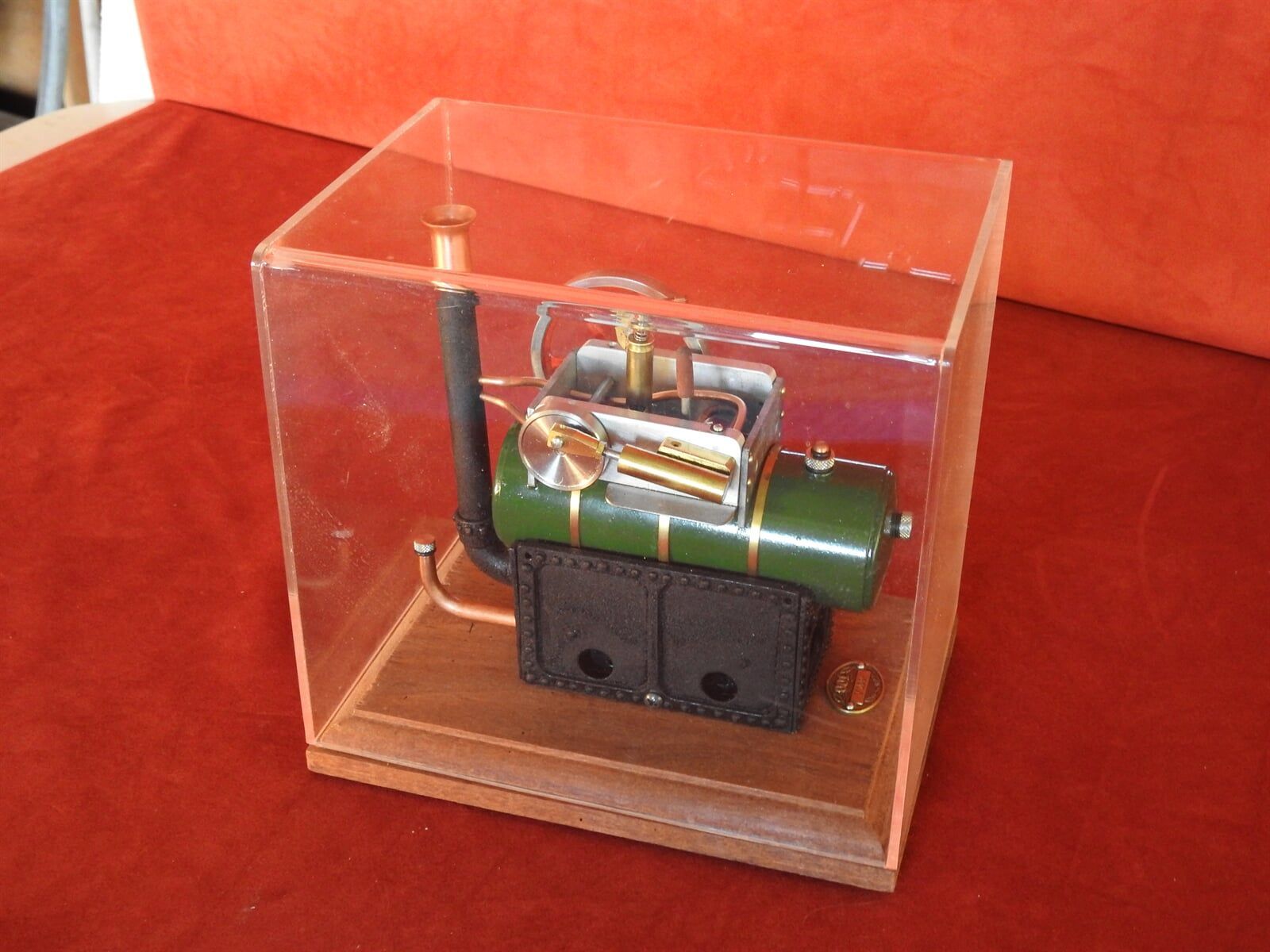 A Small Model Of A Steam Engine In A Clear Case — Light Industries in Bowral, NSW