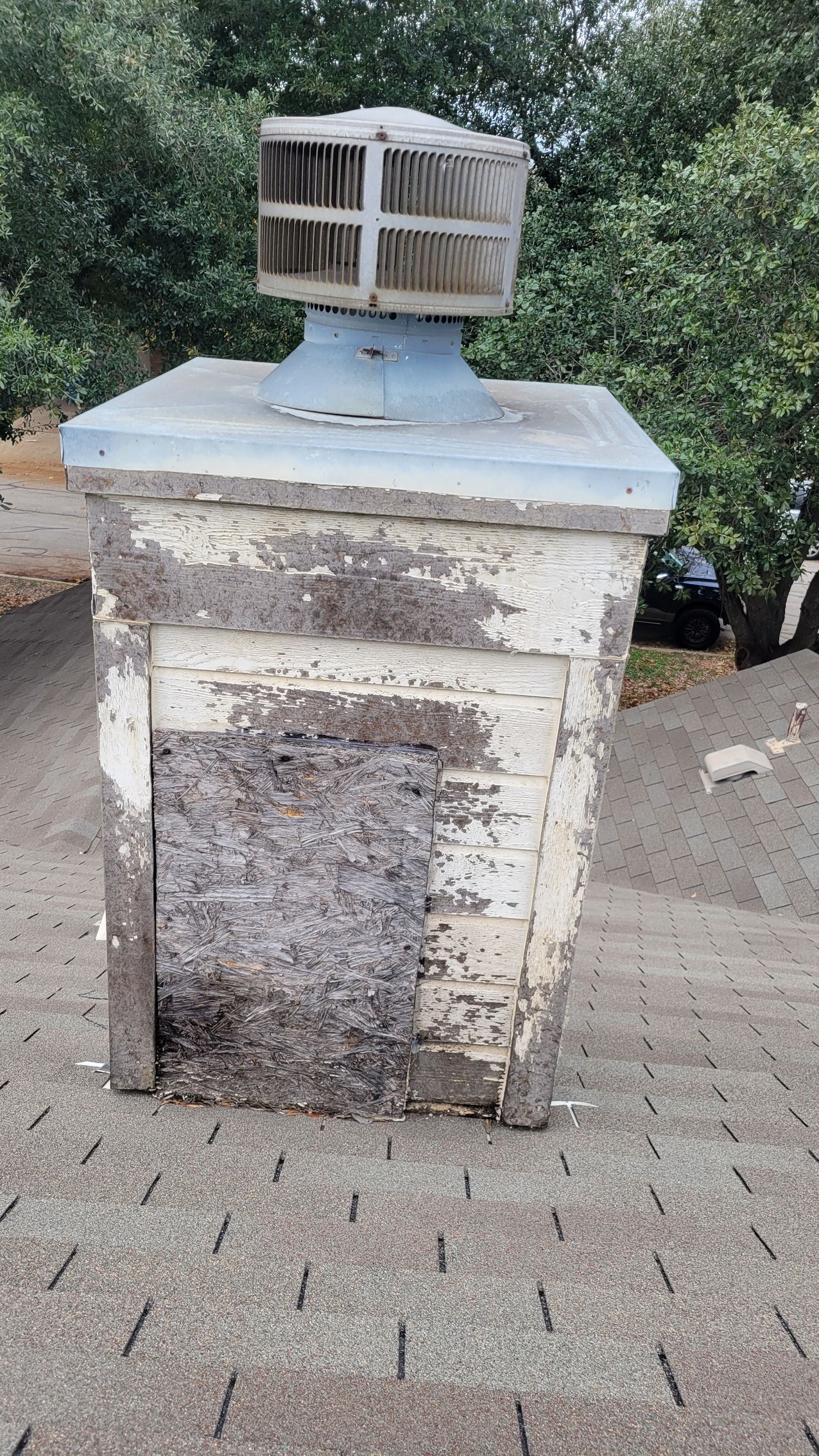 A chimney is sitting on top of a roof.