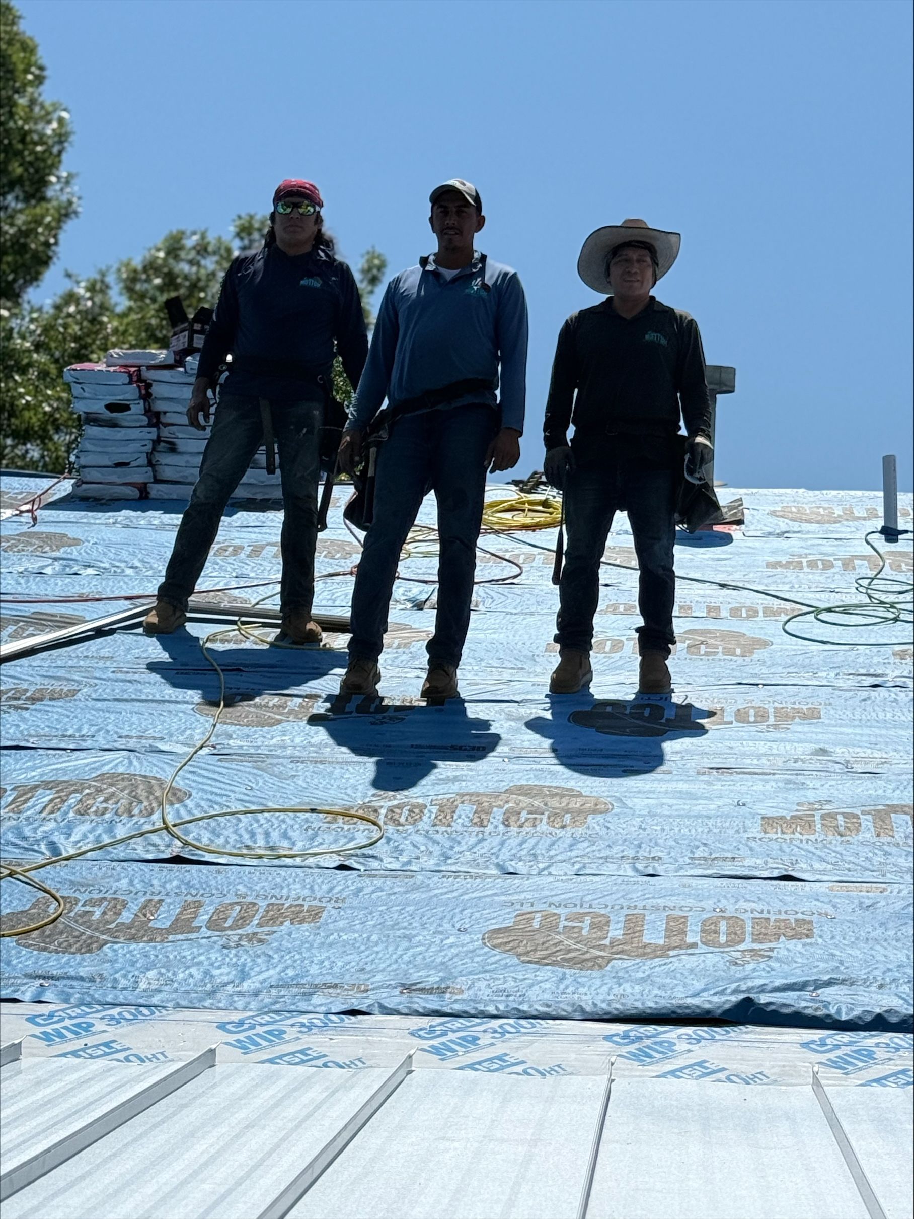 A window on a brick building with a blue sky in the background