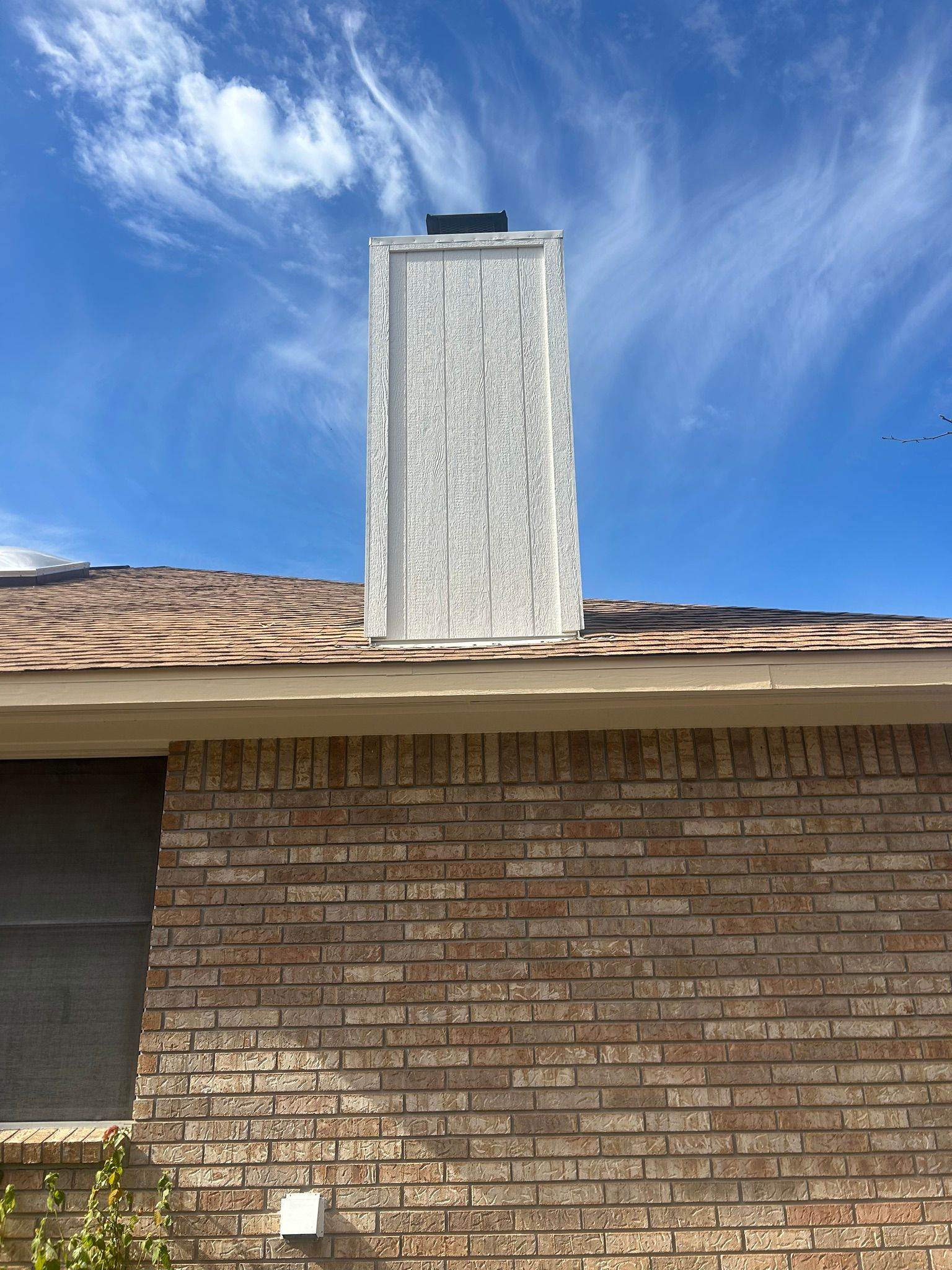 A brick building with a chimney on top of it.