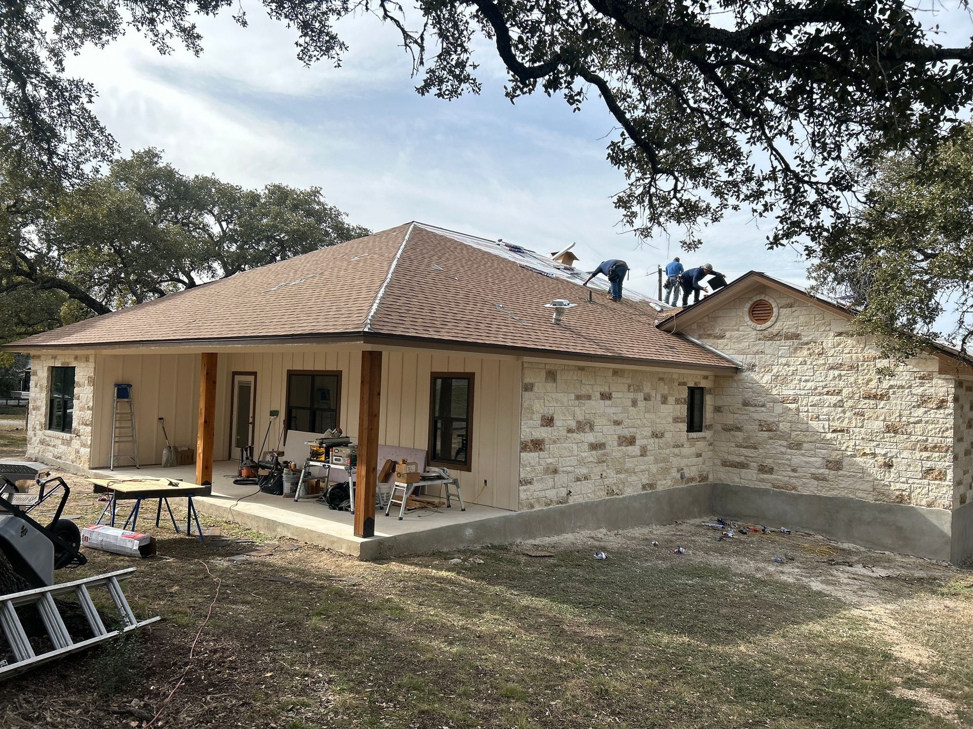 A man is working on the roof of a house.