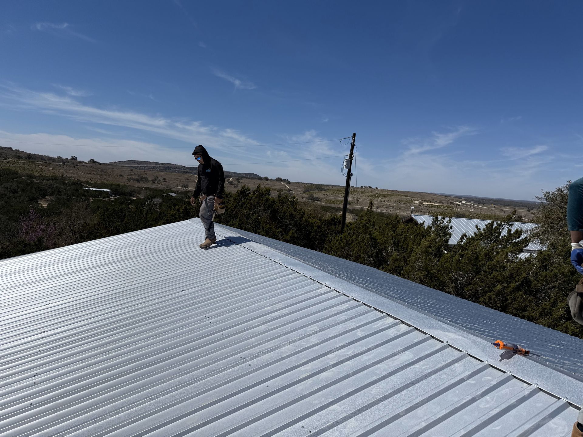 A house with a garage and a truck parked in front of it.