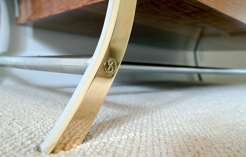 A close up of a piece of tailor made furniture on a carpet