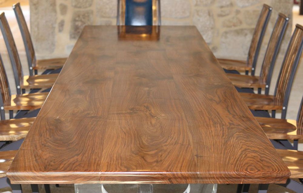 A handcrafted walnut wooden table and chairs  set. high end furniture