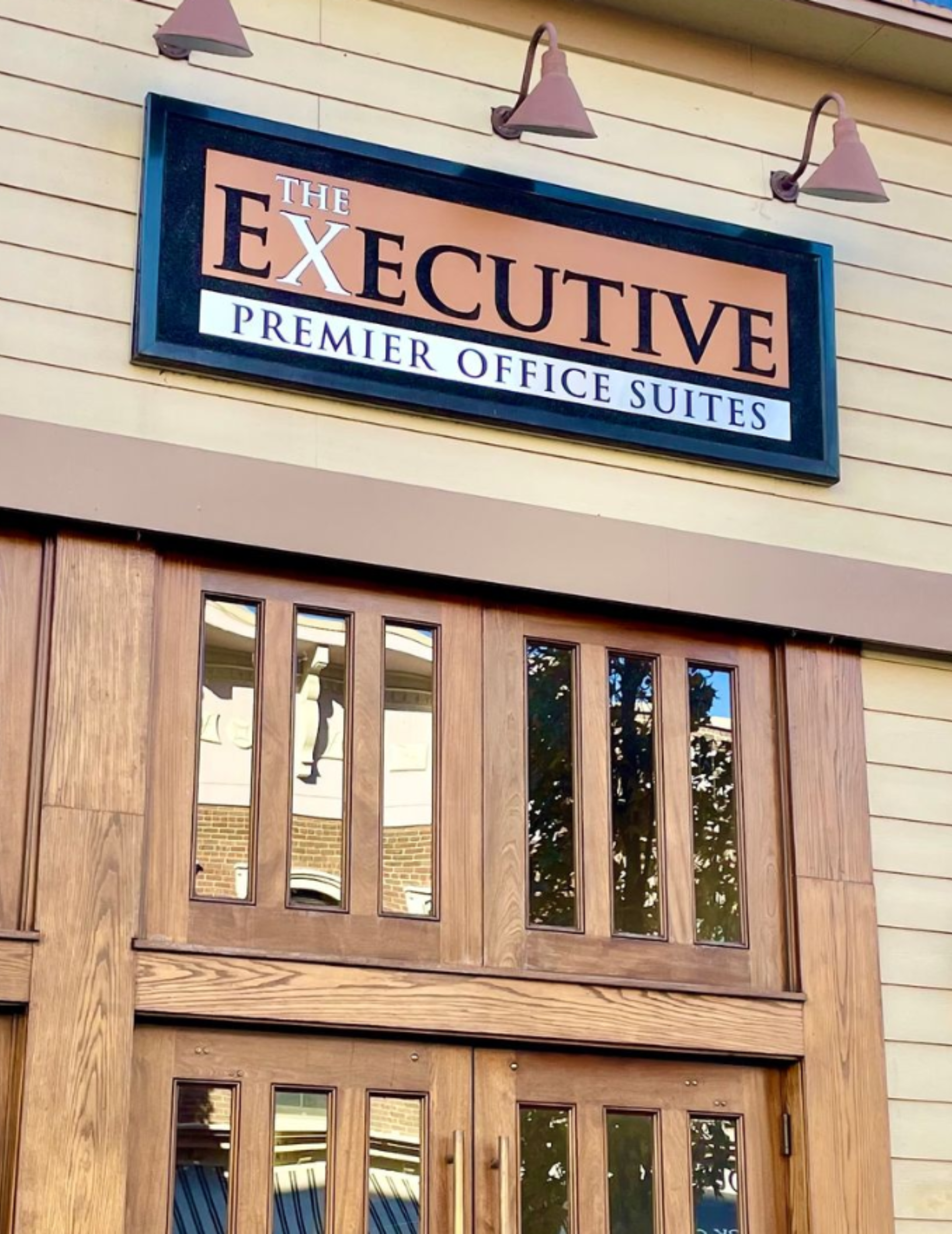 Sign and front entrance to The Executive Premier Office Suites.