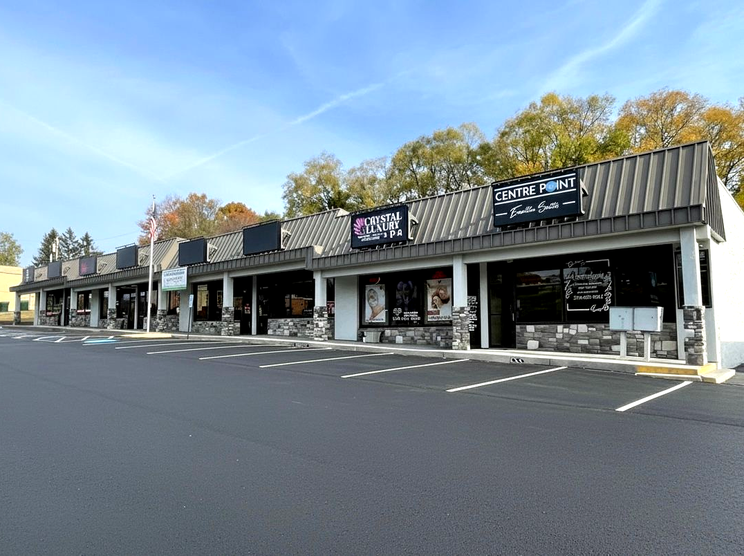Parking lot and exterior shot of businesses in Centre Point Strip Mall at Brirstol, VA.