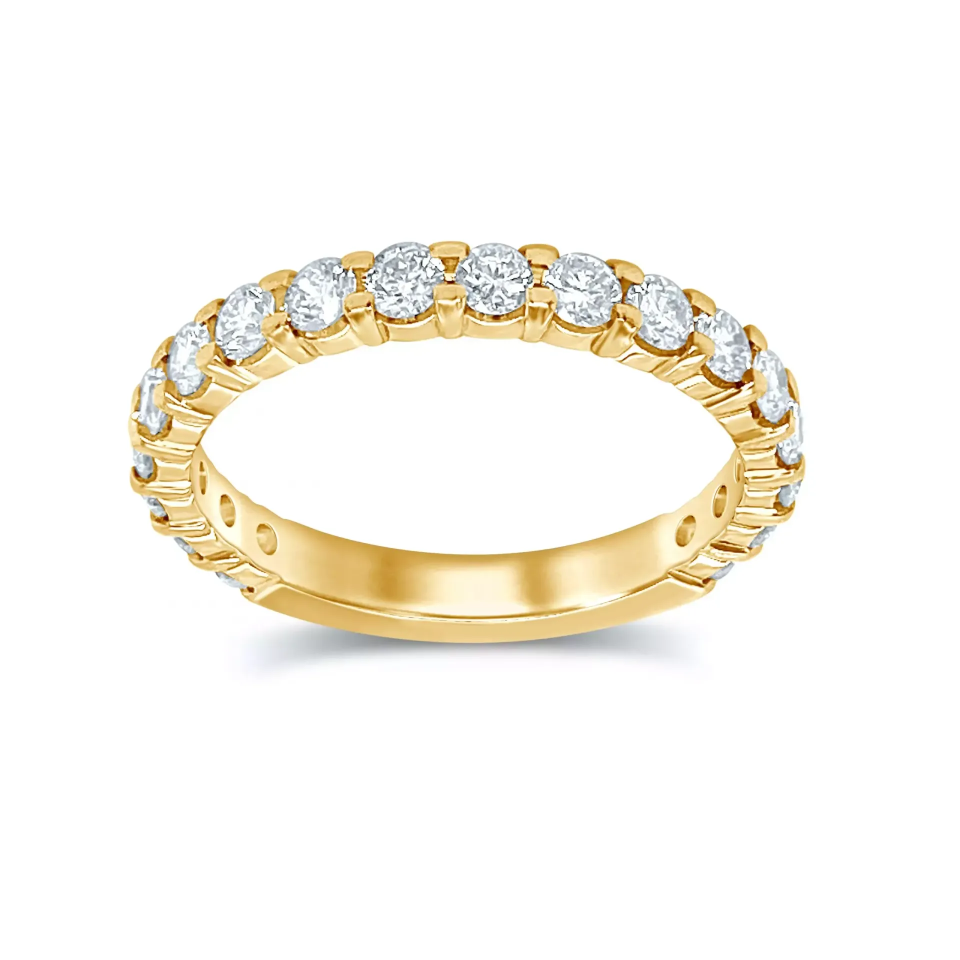 Gold eternity ring with round diamonds on a white background