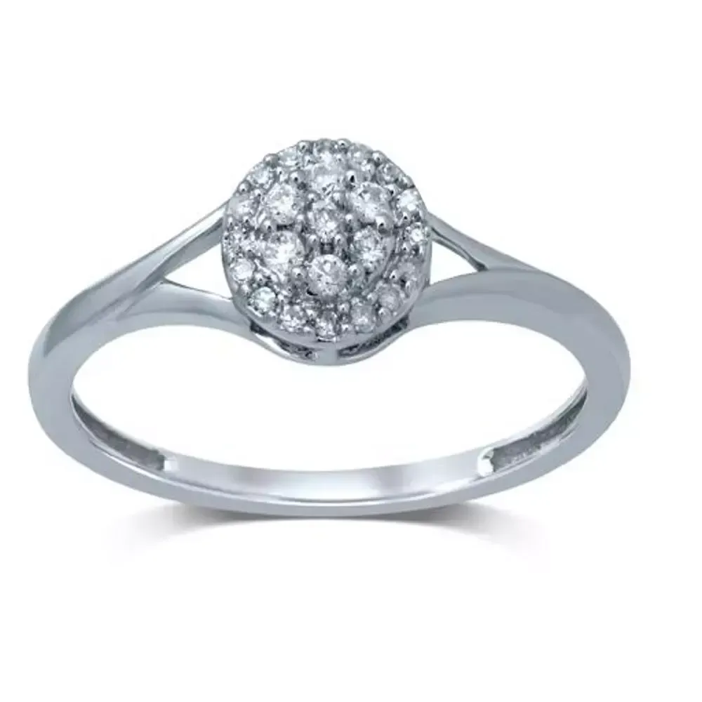 Silver ring with a round cluster of clear gemstones on a white background