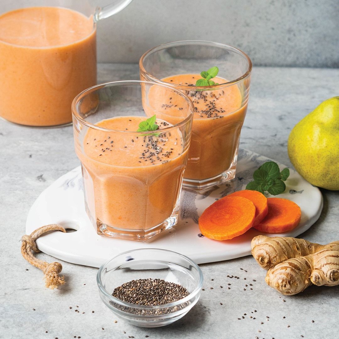 Two Orange Smoothies in Glasses, with Chia Seeds and Mint — Cedar Park Supermarket In Taranganba, QLD
