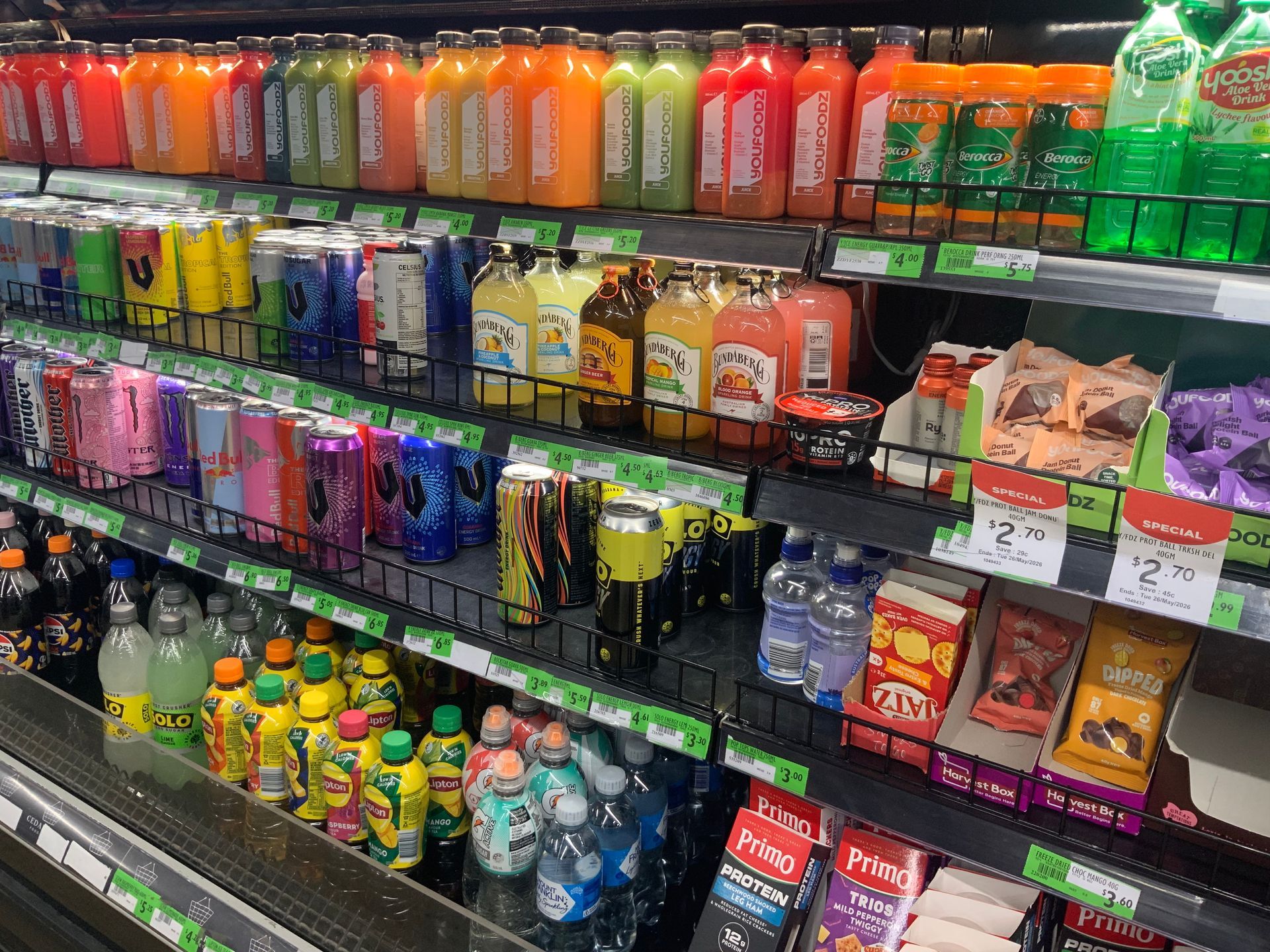 Store Shelves Stocked with Colourful Bottled Drinks — Cedar Park Supermarket In Taranganba, QLD