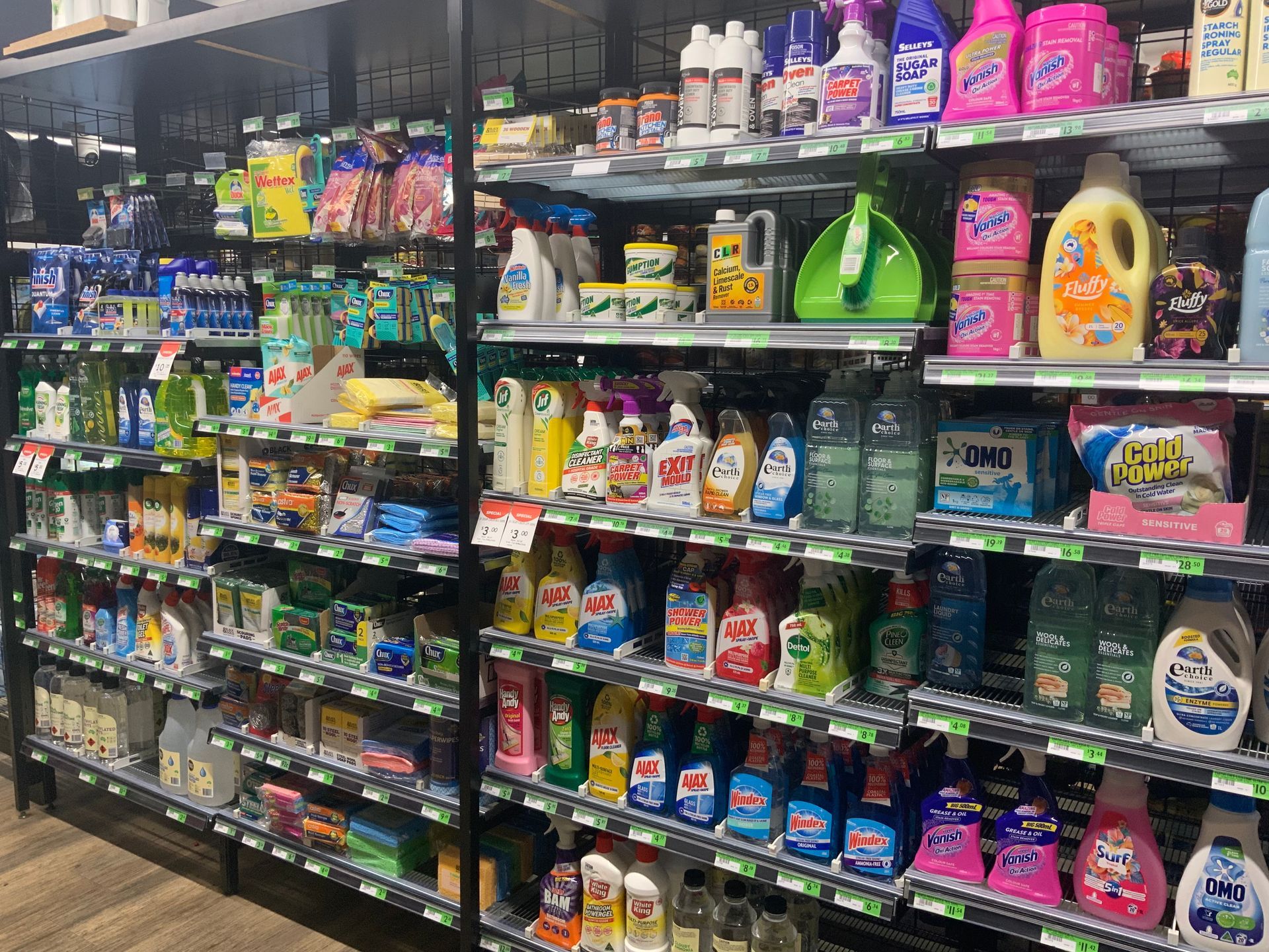 A Grocery Aisle Stocked with Colourful Laundry Detergents — Cedar Park Supermarket In Taranganba, QLD
