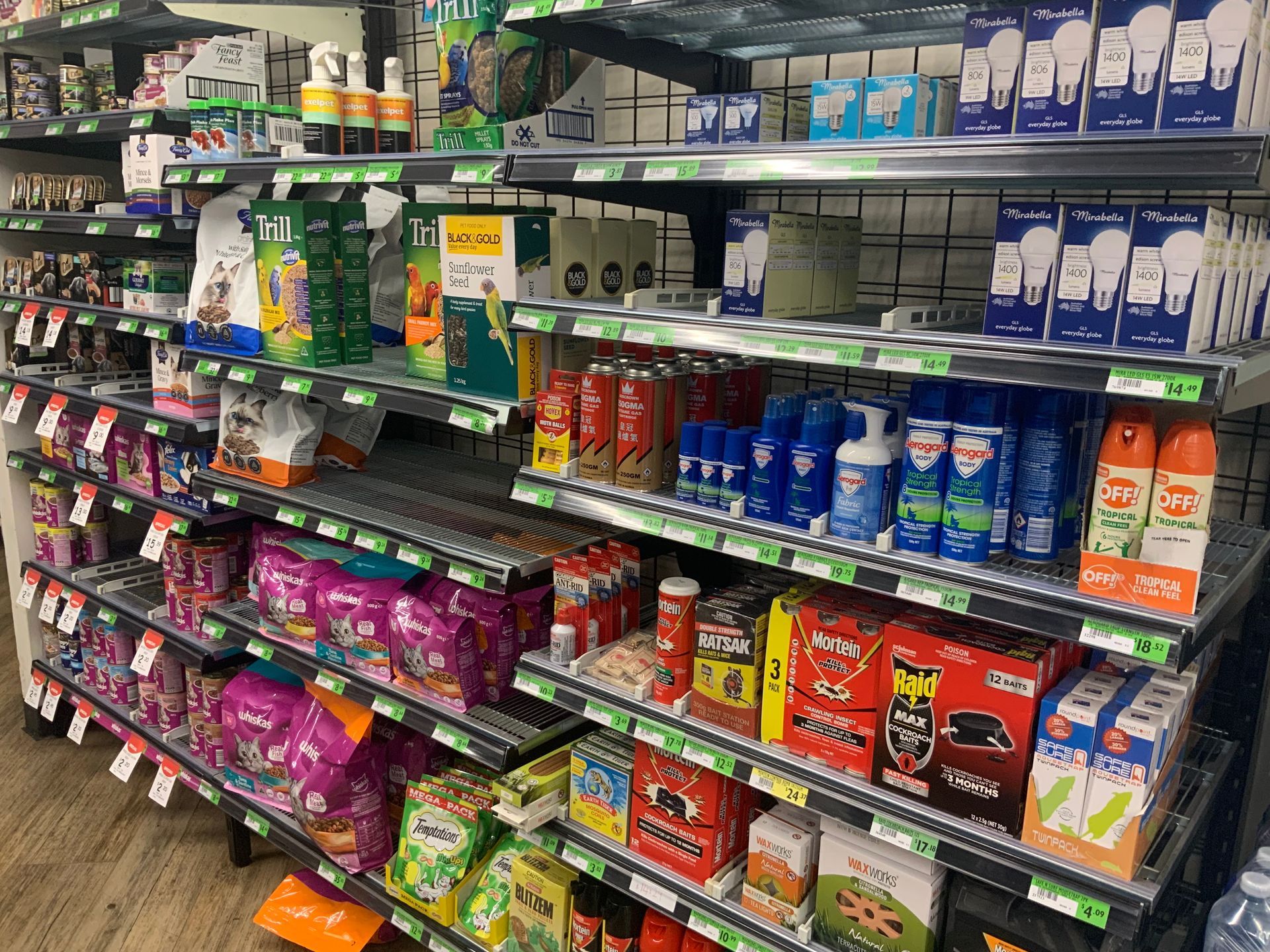 Store Aisle with Shelves of Colourful Household Cleaning Products and Paper Goods — Cedar Park Supermarket In Taranganba, QLD