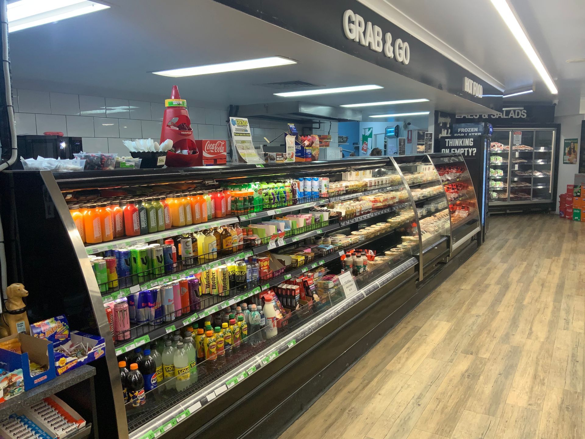 Convenience Store Snack Aisle with Refrigerated Drinks — Cedar Park Supermarket In Taranganba, QLD