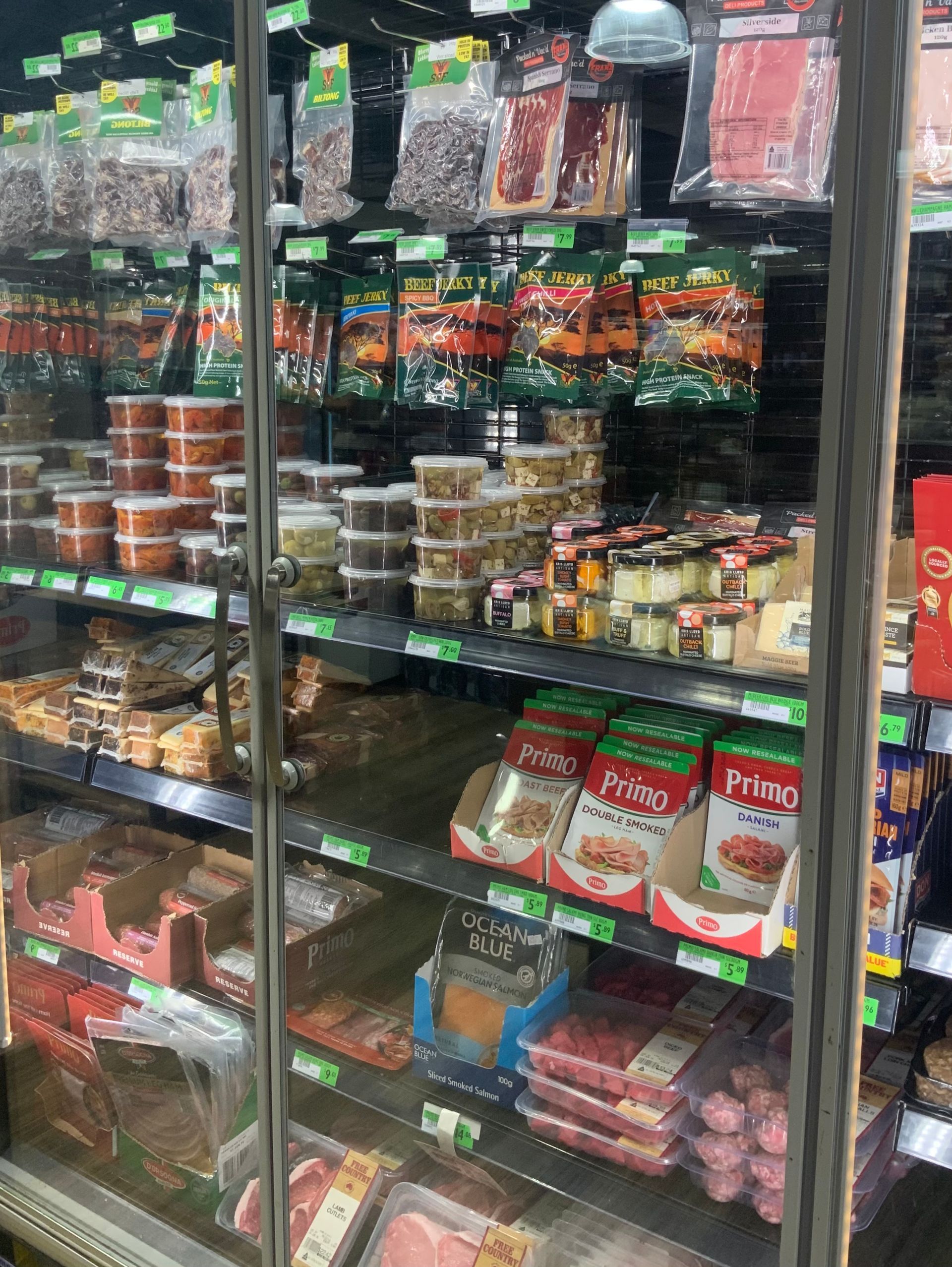 Shelved Grocery Aisle with Assorted Packaged Snacks — Cedar Park Supermarket In Taranganba, QLD