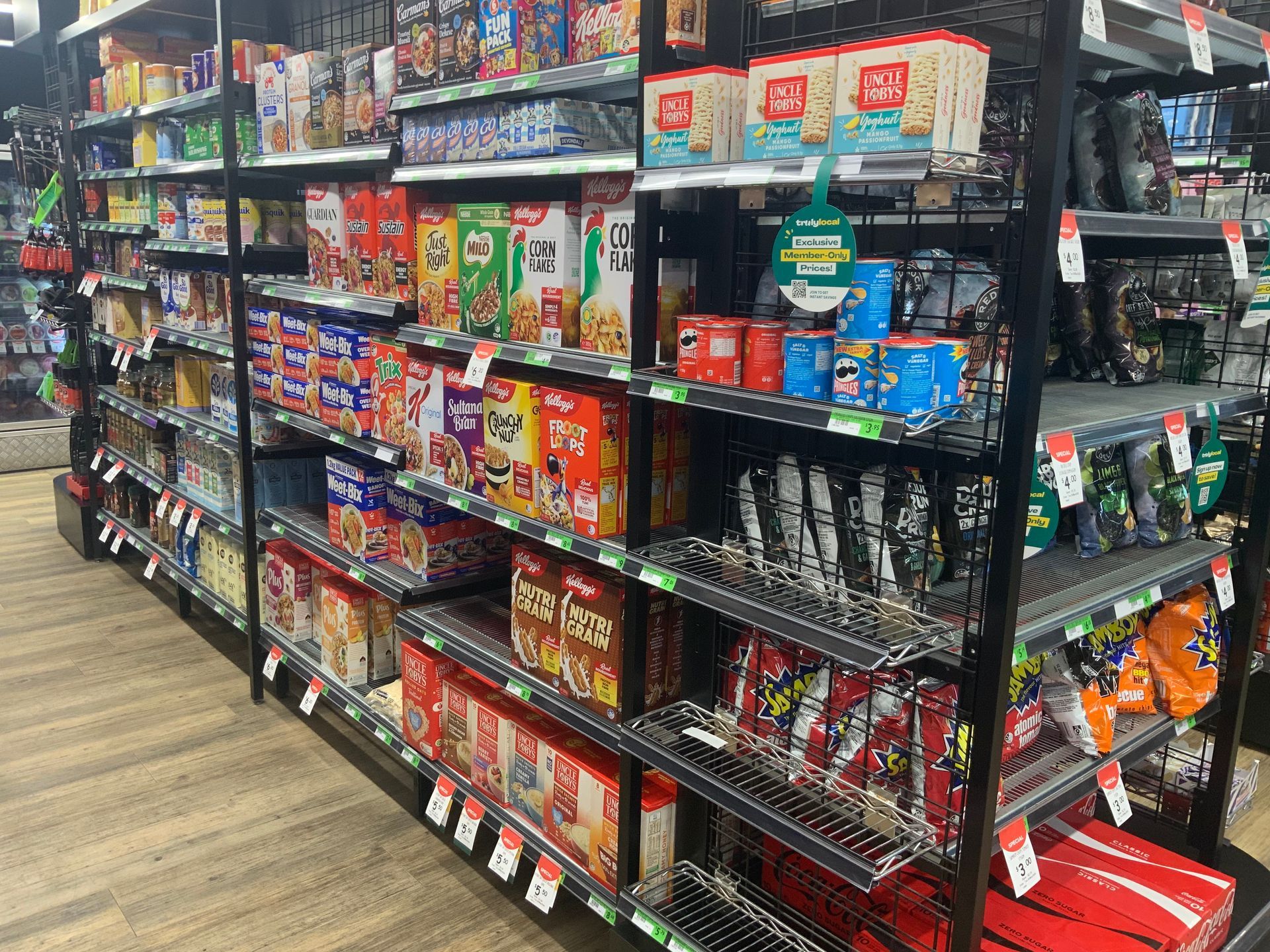 A Convenience Store Aisle Stocked with Colourful Snacks and Drinks — Cedar Park Supermarket In Taranganba, QLD