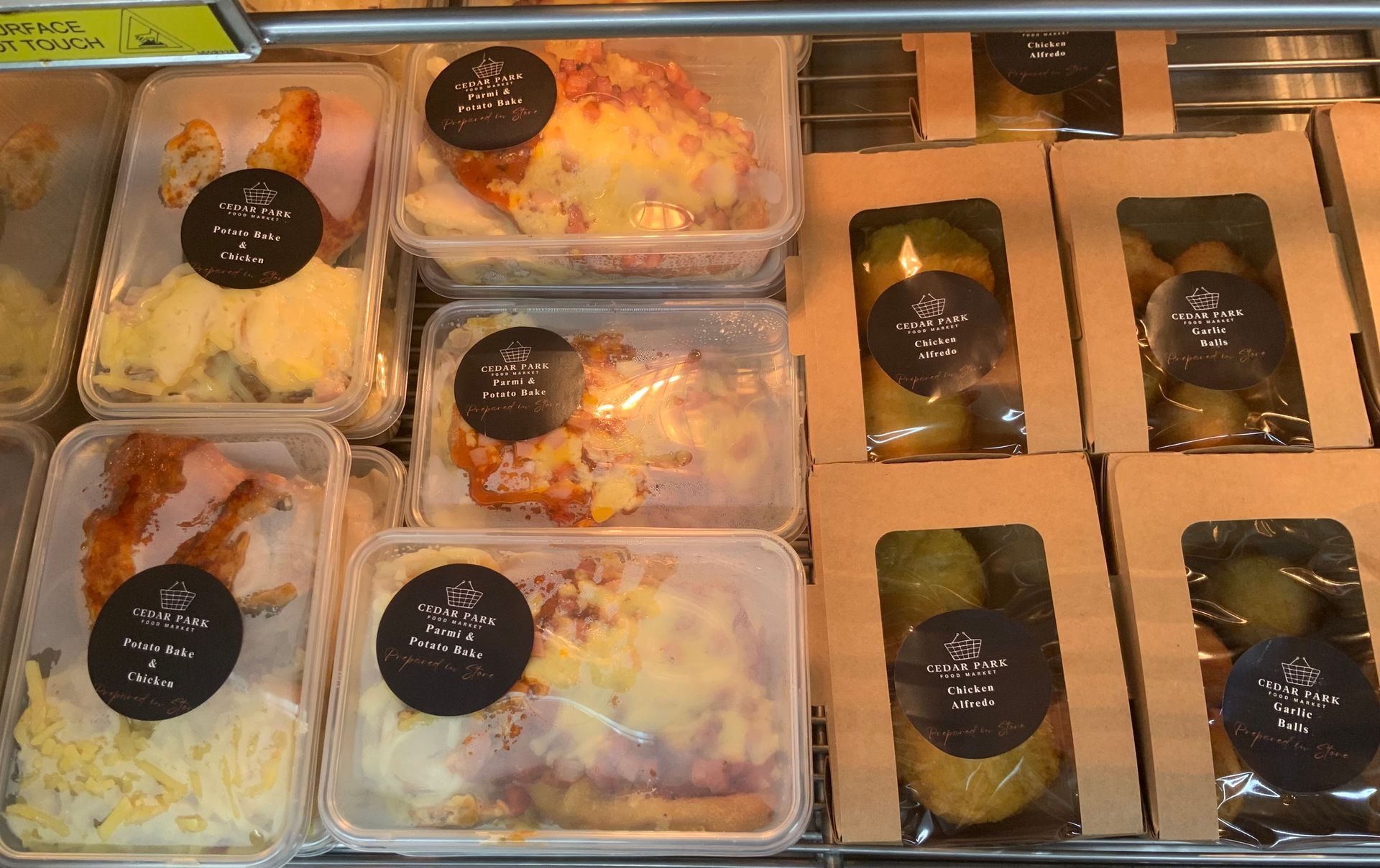 Assorted Packaged Desserts in A Display Box, Including Fruit-Topped Cups — Cedar Park Supermarket In Taranganba, QLD